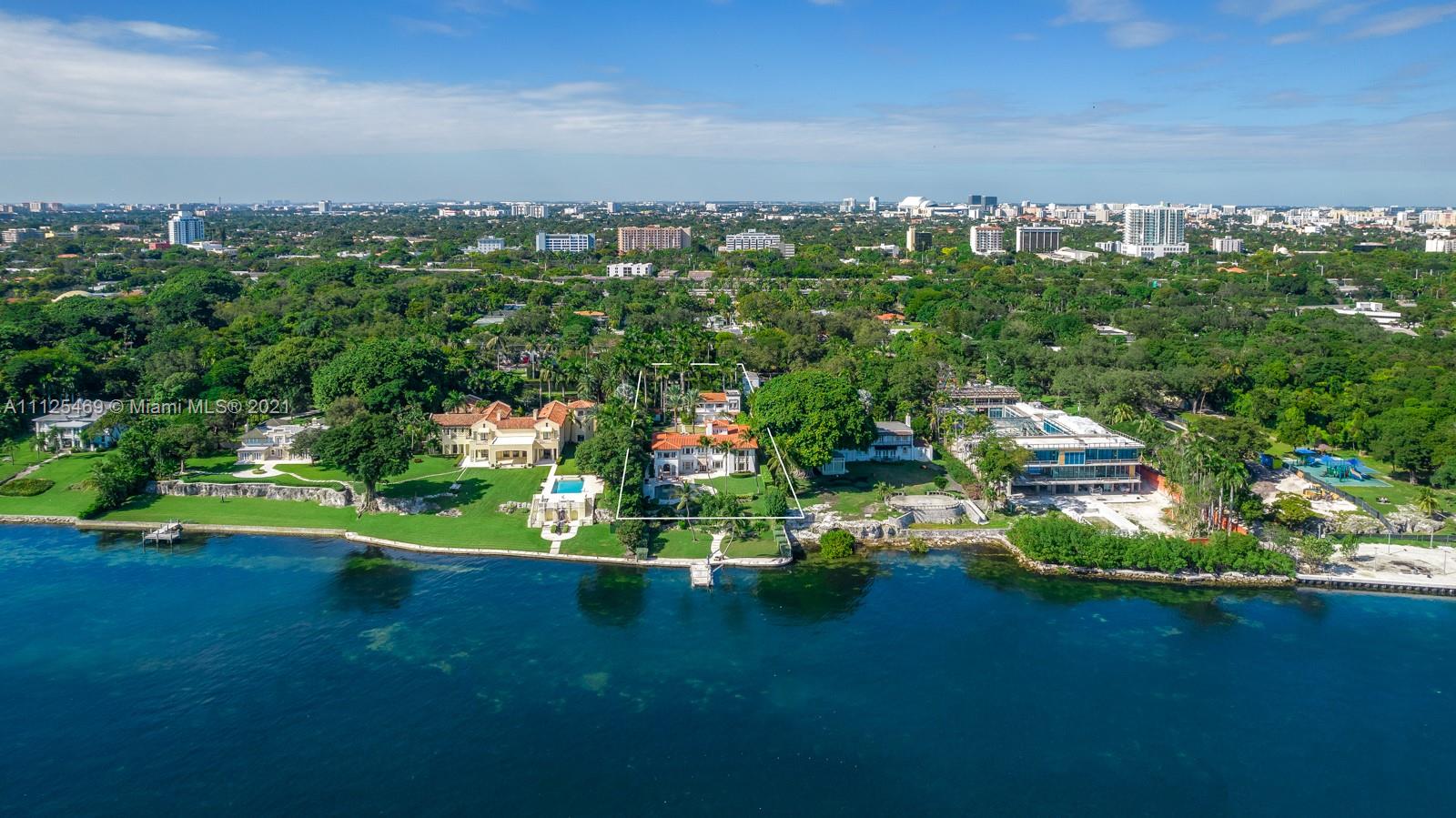 3029 Brickell Avenue Miami, FL 33133 - Photo 19 of 41 an aerial view of a house with a yard and lake view