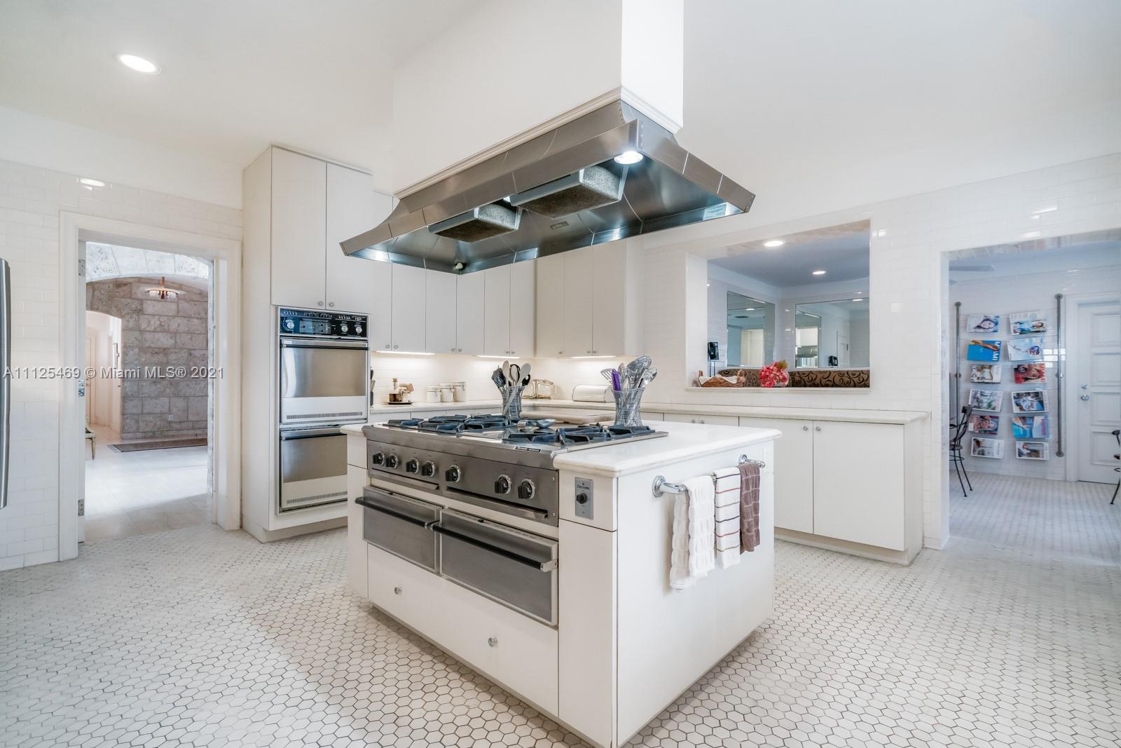 3029 Brickell Avenue Miami, FL 33133 - Photo 30 of 41 a kitchen with a stove and a refrigerator