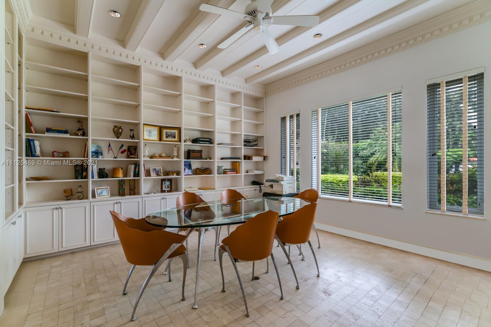 3029 Brickell Avenue Miami, FL 33133 - Photo 32 of 41 a dining room with furniture and a large window