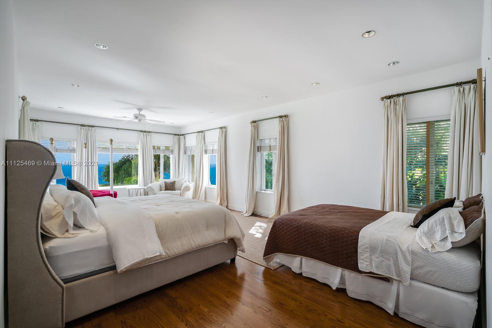 3029 Brickell Avenue Miami, FL 33133 - Photo 34 of 41 a bedroom with a bed mirror and window