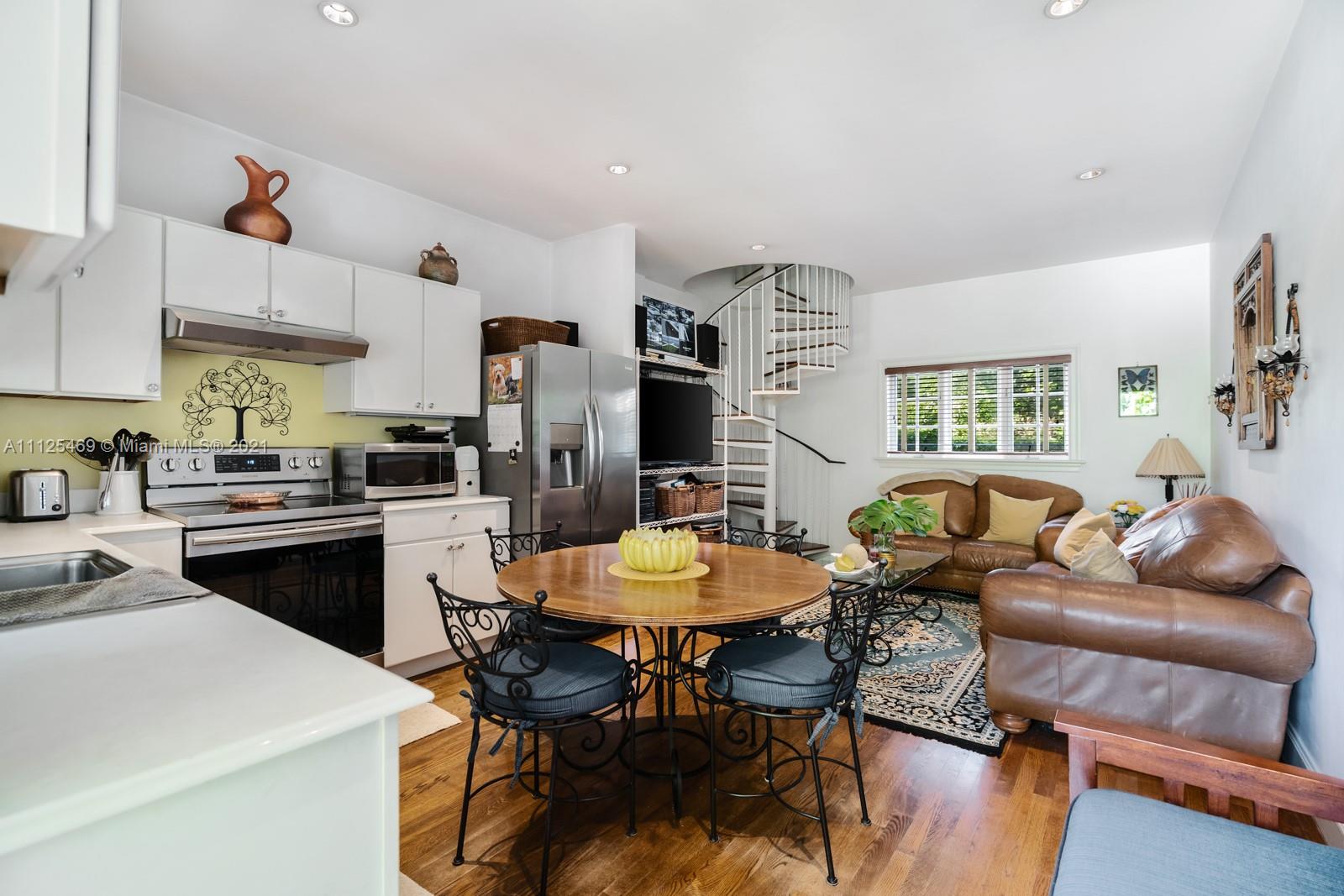 3029 Brickell Avenue Miami, FL 33133 - Photo 40 of 41 a view of a dining room with furniture and a kitchen
