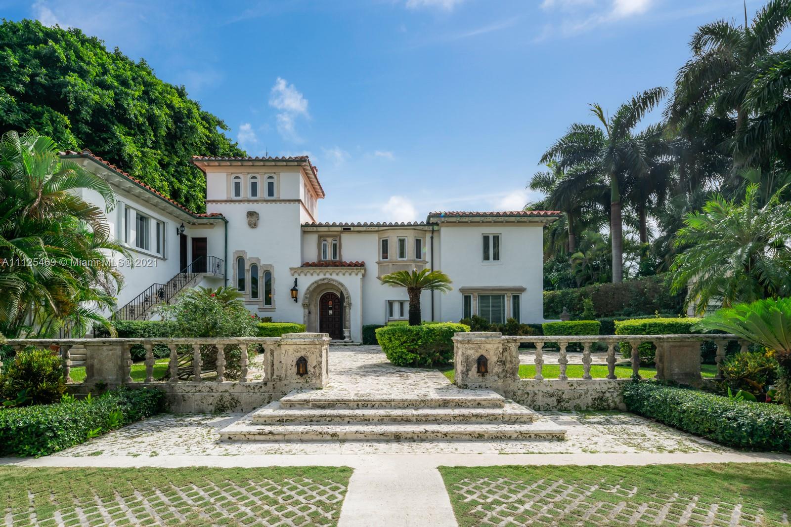 3029 Brickell Avenue Miami, FL 33133 - Photo 5 of 41 a front view of a house with garden