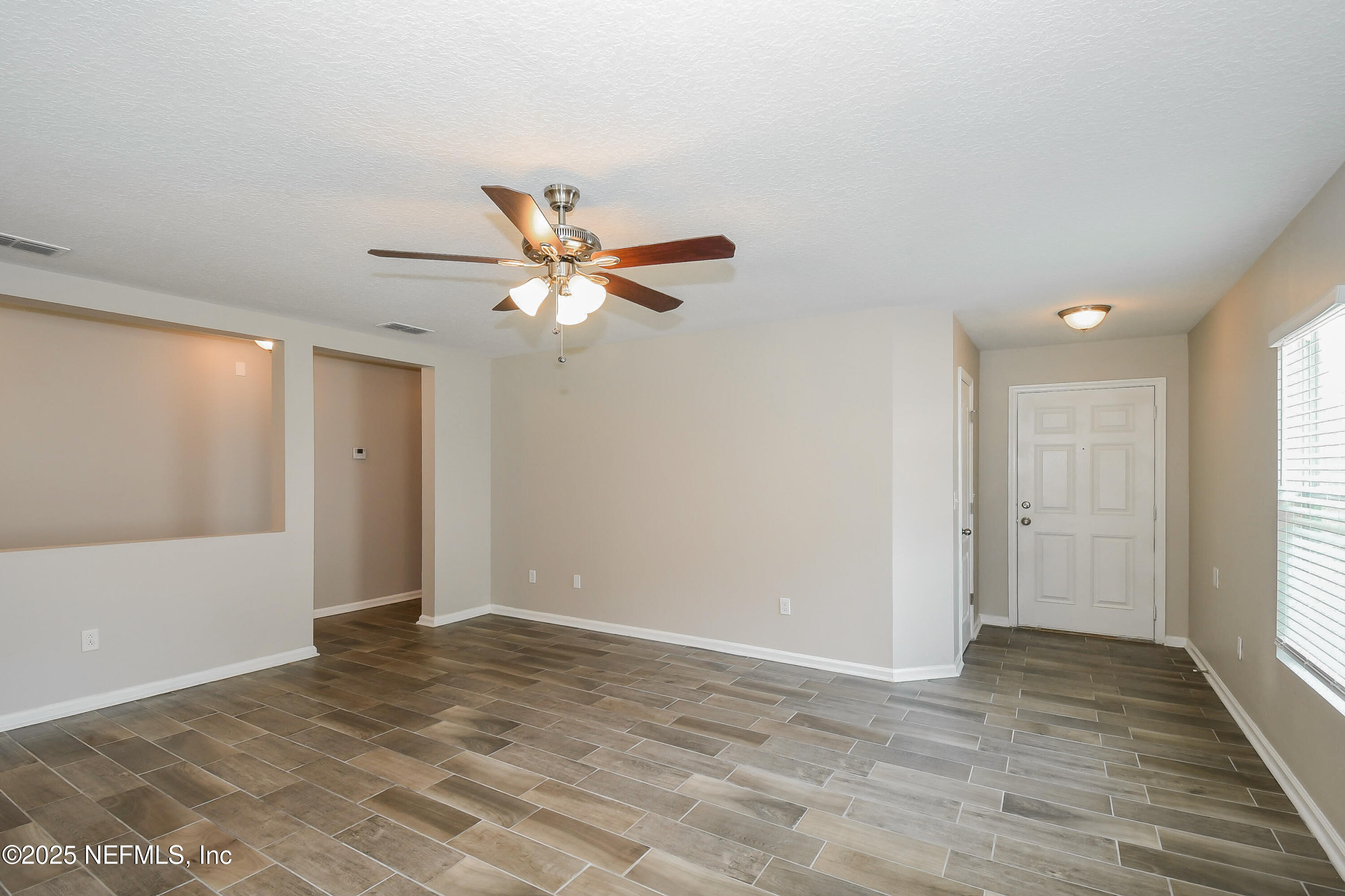 3786 Robena Road Jacksonville, FL 32218 - Photo 3 of 16 a view of a livingroom with a ceiling fan