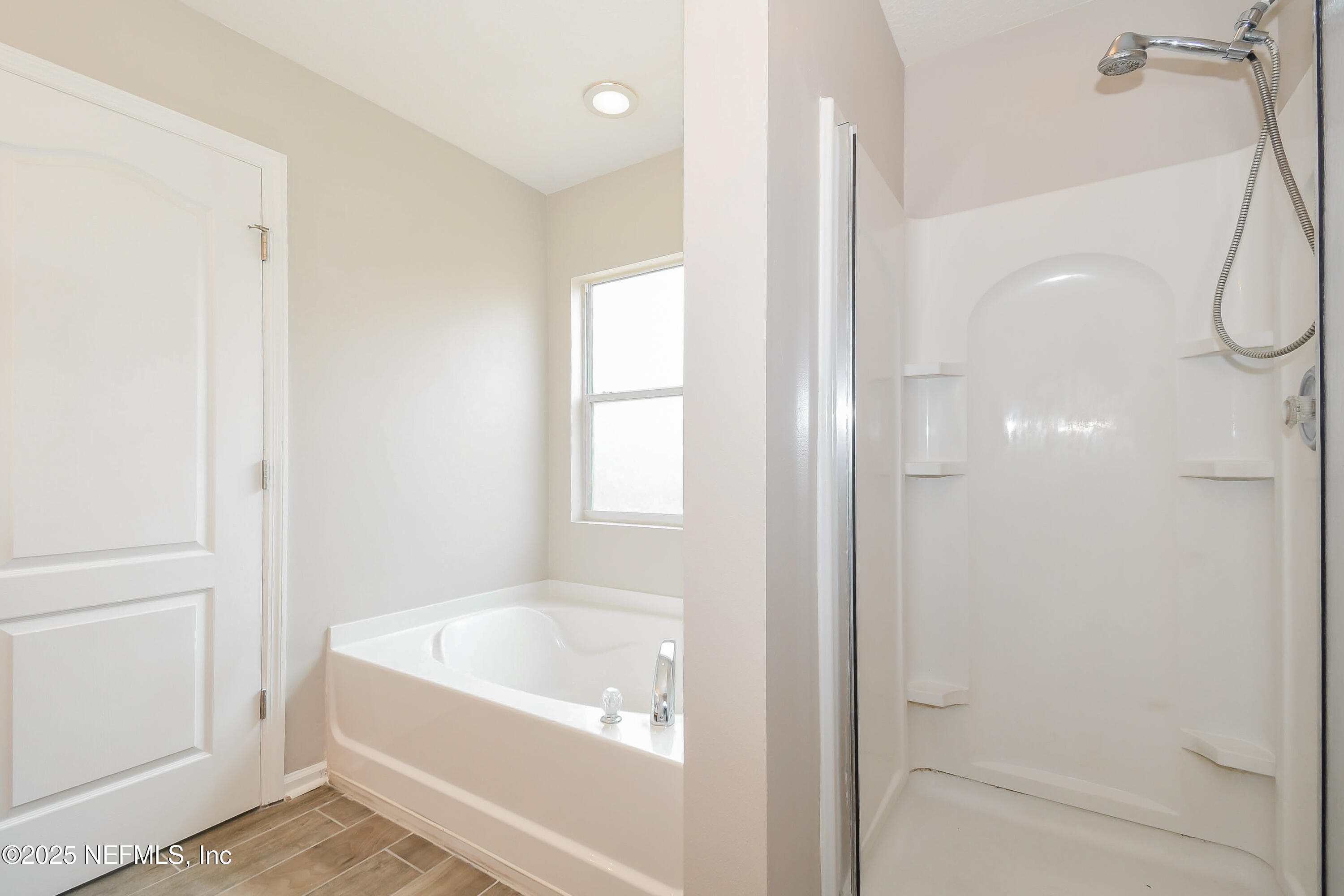 3786 Robena Road Jacksonville, FL 32218 - Photo 10 of 16 a bathroom with a bathtub and a shower