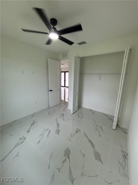 1233 Augusta Street East Lehigh Acres, FL 33974 - Photo 10 of 18 an empty room with ceiling fan