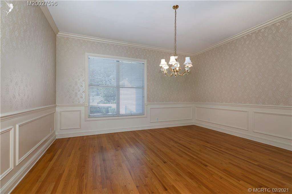 38 West High Point Road Stuart, FL 34996 - Photo 12 of 32 a view of empty room with wooden floor and fan