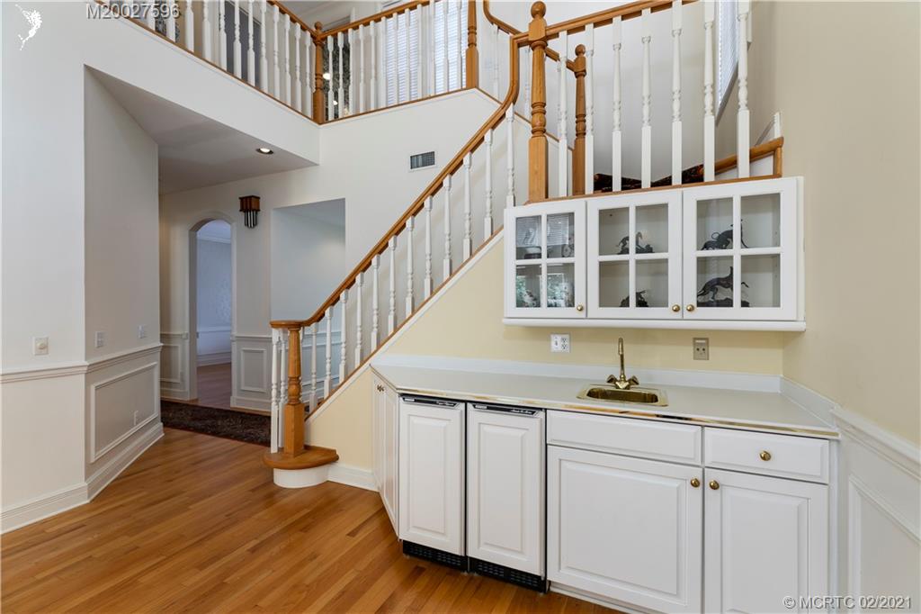 38 West High Point Road Stuart, FL 34996 - Photo 16 of 32 a view of staircase with white walls and a window