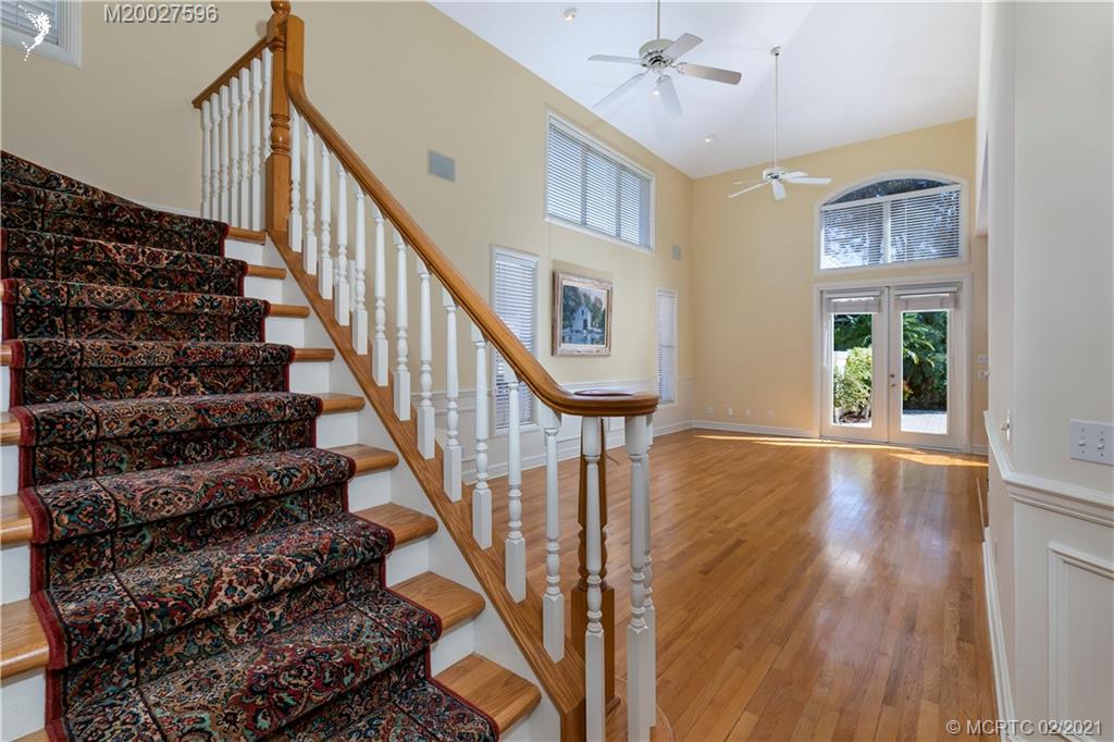 38 West High Point Road Stuart, FL 34996 - Photo 17 of 32 a view of entryway and hall with wooden floor