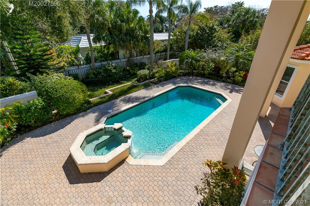 38 West High Point Road Stuart, FL 34996 - Photo 20 of 32 a view of a swimming pool with a patio