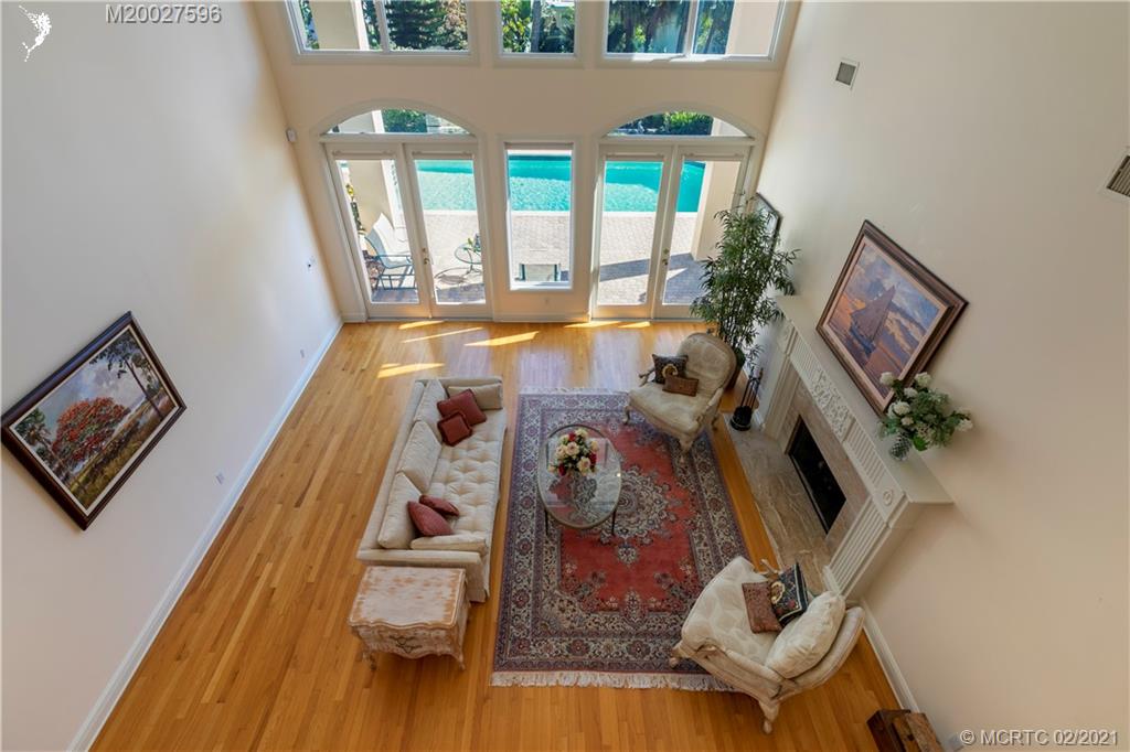 38 West High Point Road Stuart, FL 34996 - Photo 21 of 32 a view of living room with furniture and a large window