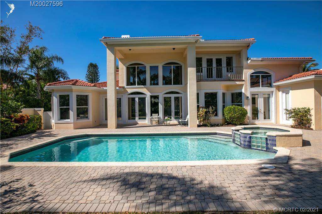 38 West High Point Road Stuart, FL 34996 - Photo 23 of 32 a front view of a house with swimming pool having outdoor seating
