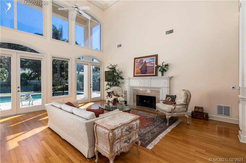 38 West High Point Road Stuart, FL 34996 - Photo 6 of 32 a living room with furniture and a fireplace
