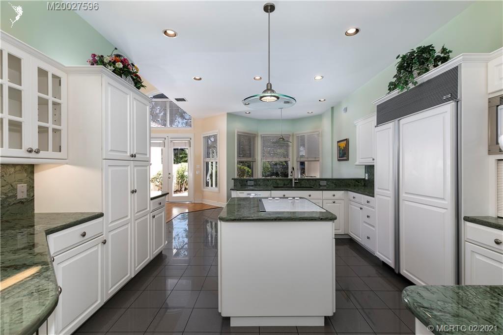 38 West High Point Road Stuart, FL 34996 - Photo 8 of 32 a open kitchen with stainless steel appliances granite countertop a refrigerator a oven and white cabinets