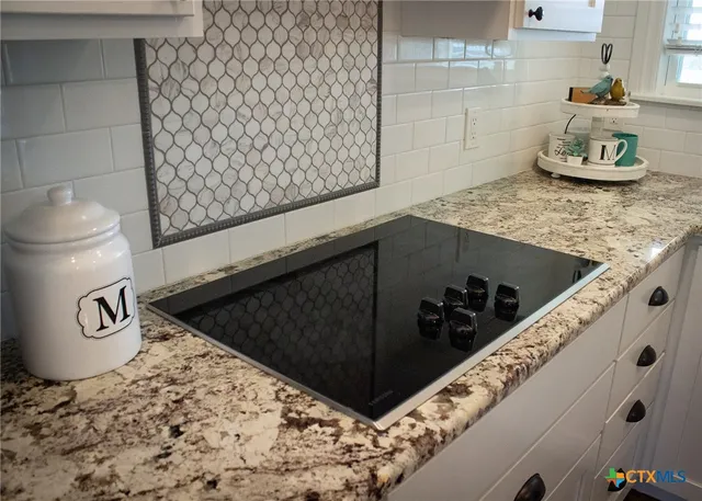 a view of a dining room with furniture wooden floor and chandelier
