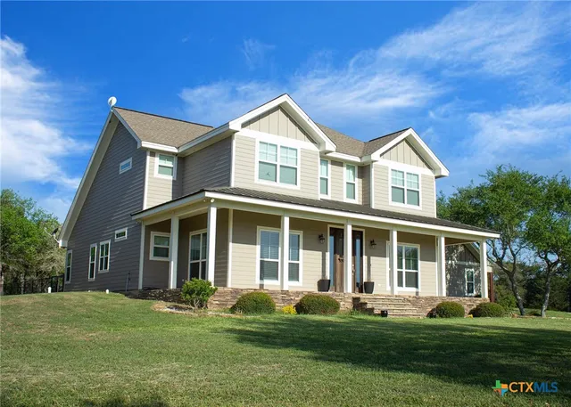 front view of a house with a yard
