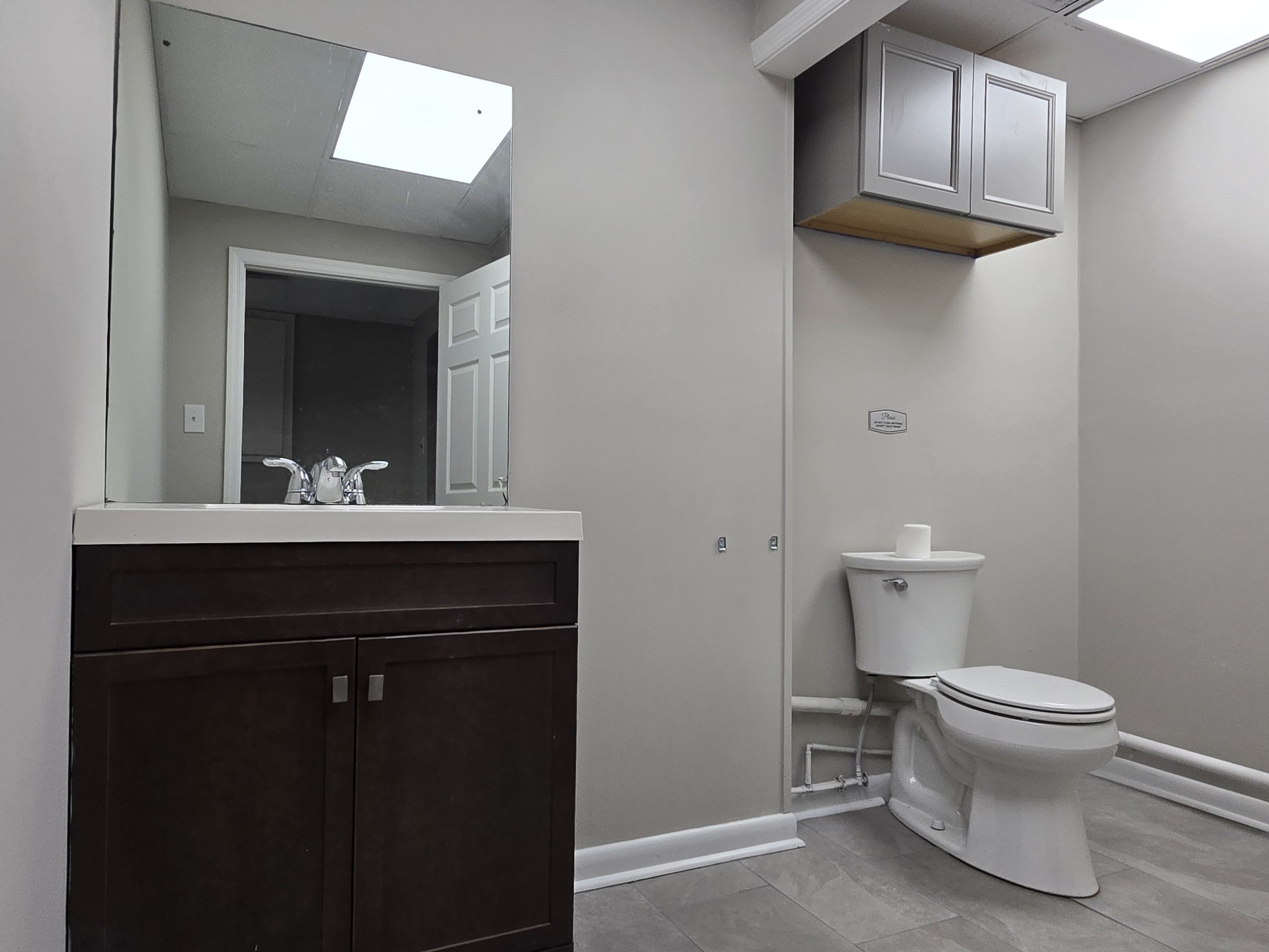 101 South Main Street Mount Pleasant, TN 38474 - Photo 6 of 10 a bathroom with a sink and a toilet