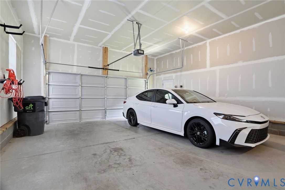 12040 Kenton Ridge Road Ashland, VA 23005 - Photo 22 of 54 Spacious two-car garage featuring a concrete floor