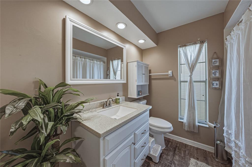 7435 Kilbride Court Weeki Wachee, FL 34613 - Photo 27 of 67 a bathroom with a sink toilet and shower