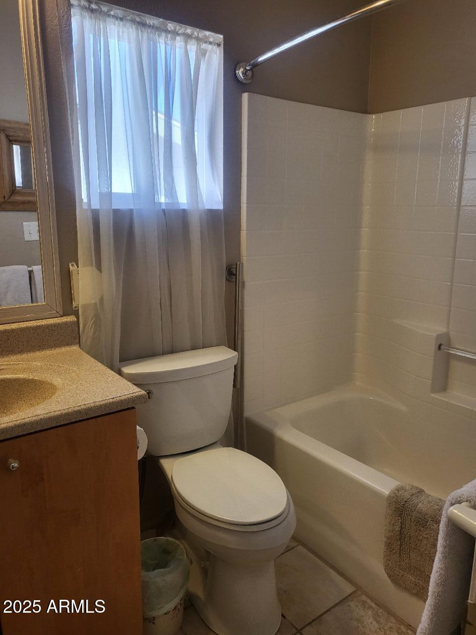 17200 West Bell Road, Unit 2301 Surprise, AZ 85374 - Photo 11 of 29 a bathroom with a toilet a sink and bathtub