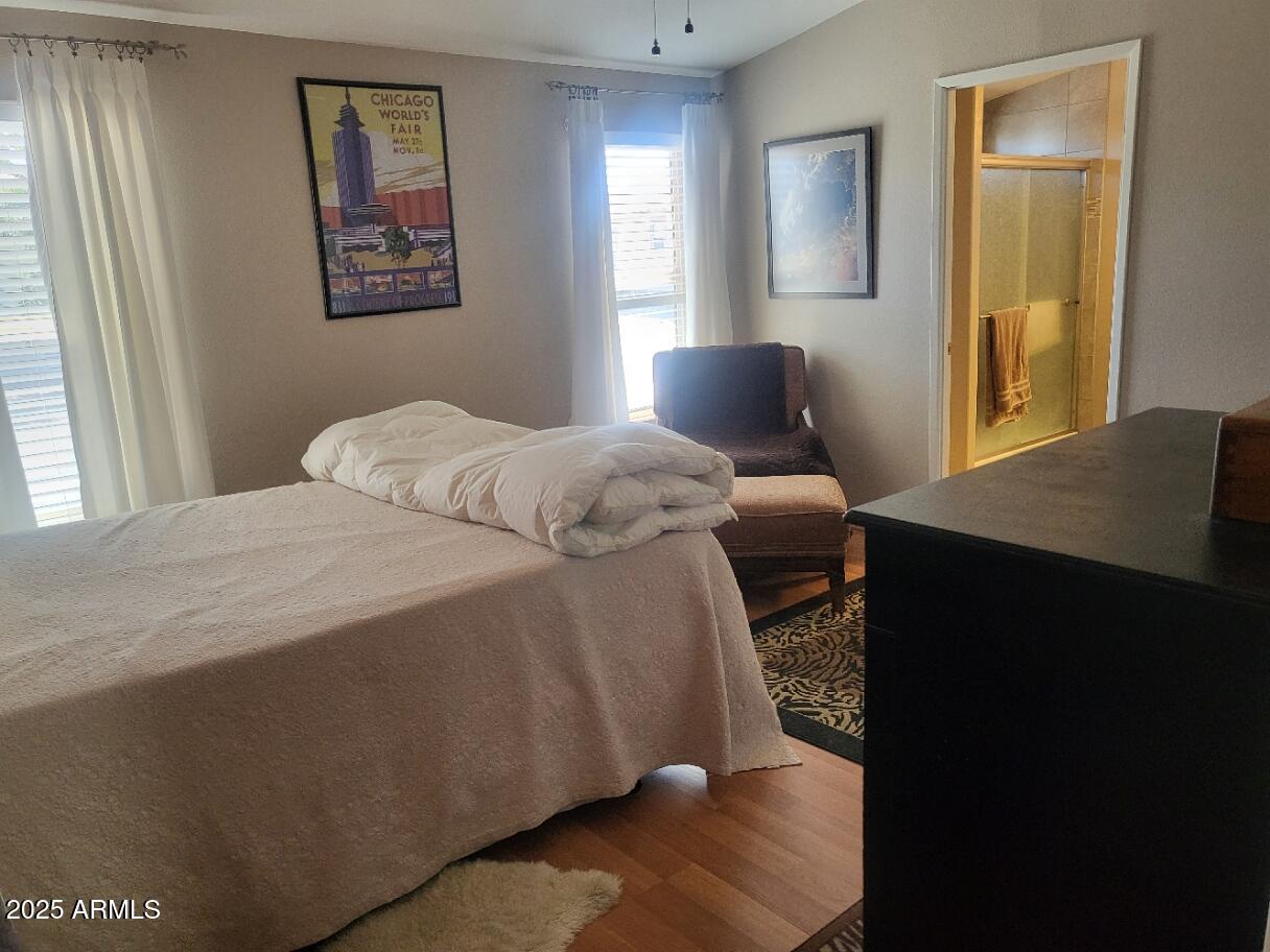 17200 West Bell Road, Unit 2301 Surprise, AZ 85374 - Photo 13 of 29 a bedroom with a bed and a window