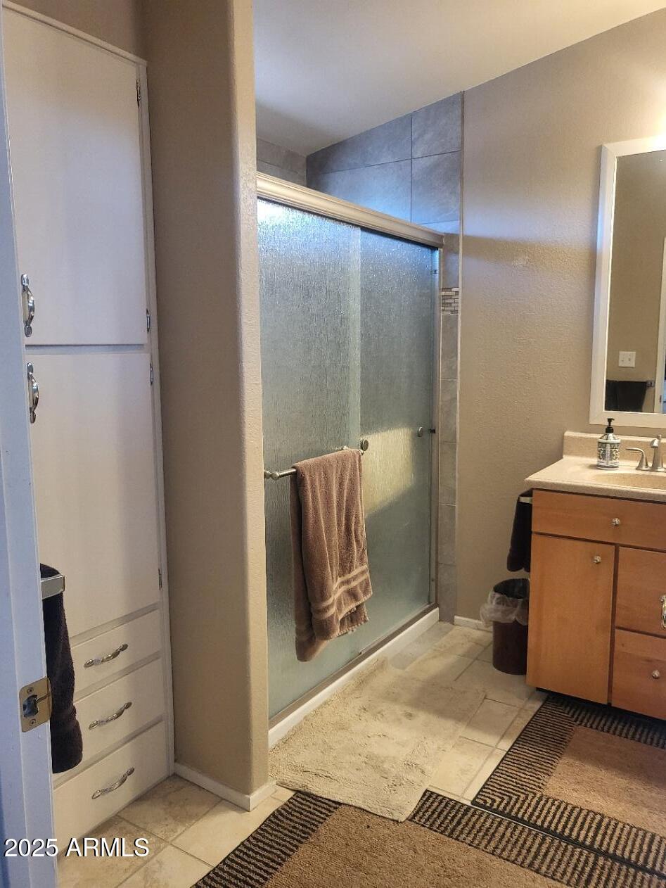 17200 West Bell Road, Unit 2301 Surprise, AZ 85374 - Photo 14 of 29 a bathroom with a sink and a mirror