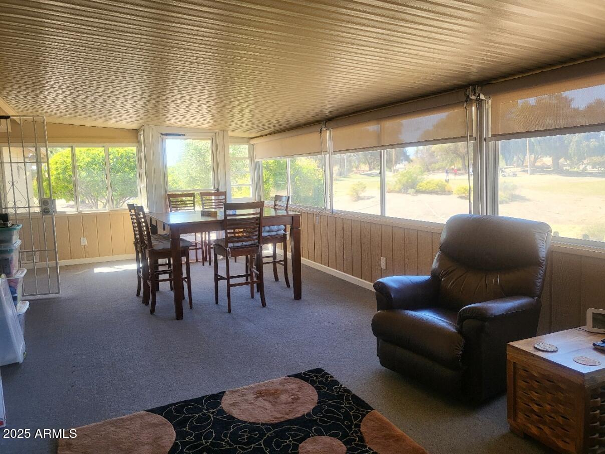 17200 West Bell Road, Unit 2301 Surprise, AZ 85374 - Photo 19 of 29 a dining room with furniture and large windows
