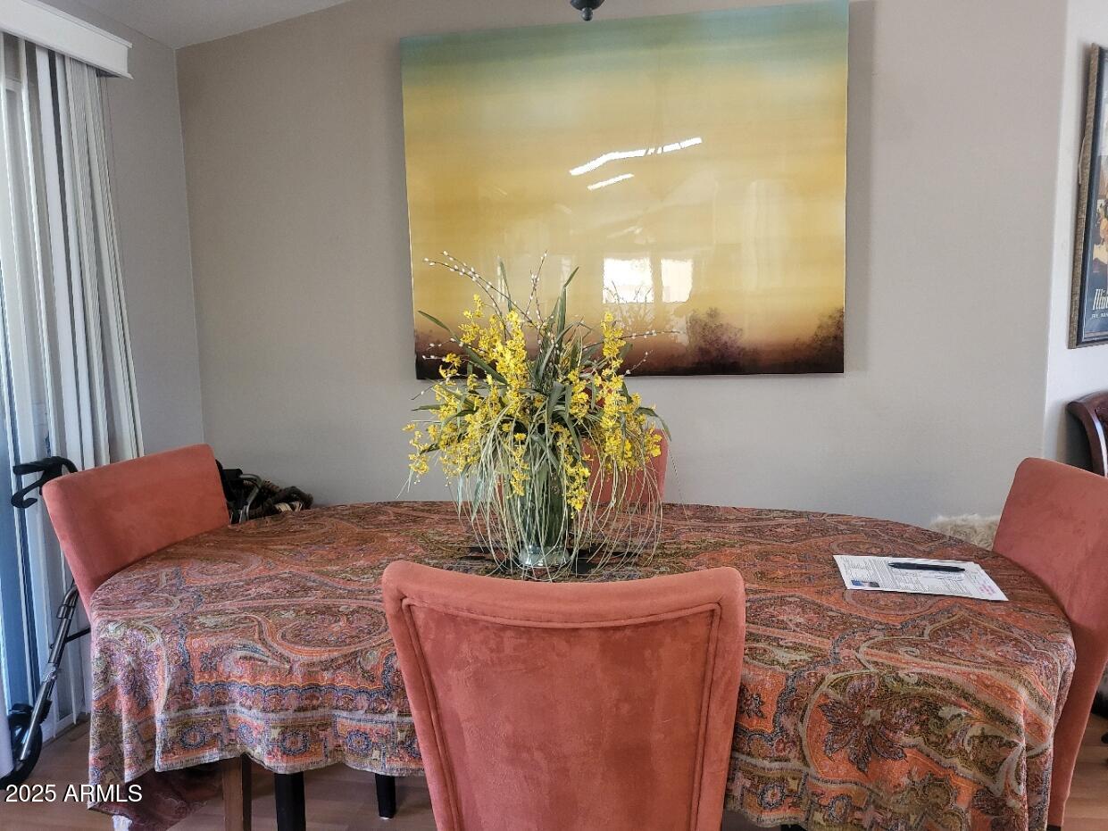 17200 West Bell Road, Unit 2301 Surprise, AZ 85374 - Photo 20 of 29 a bedroom with a bed and ceiling fan