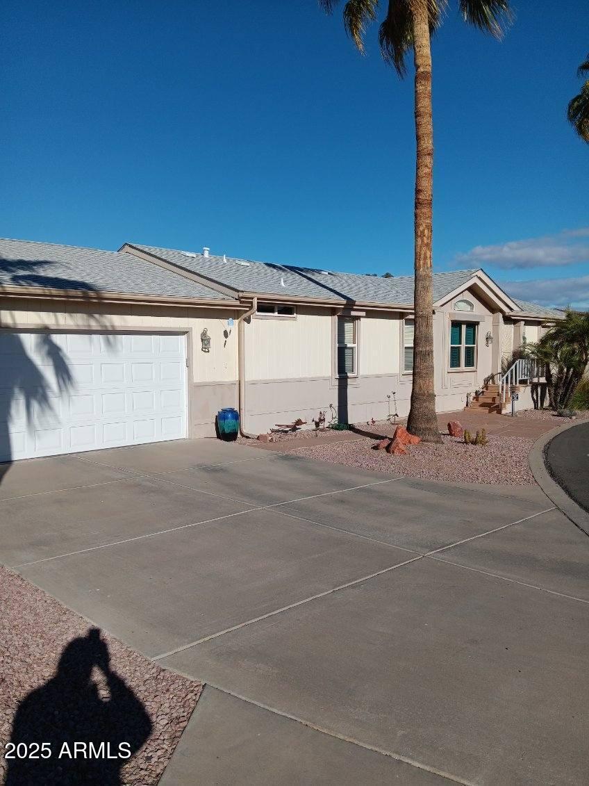 17200 West Bell Road, Unit 2301 Surprise, AZ 85374 - Photo 2 of 29 a view of a street with a house