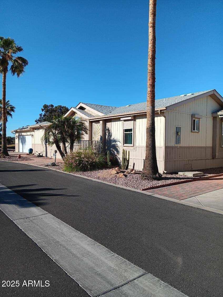17200 West Bell Road, Unit 2301 Surprise, AZ 85374 - Photo 3 of 29 a view of a street with a building on the street