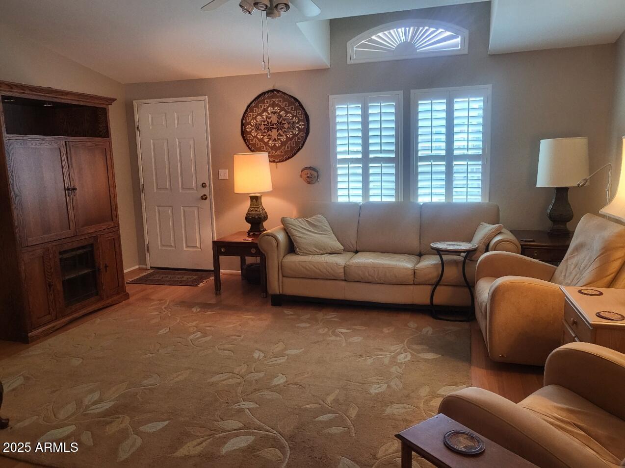 17200 West Bell Road, Unit 2301 Surprise, AZ 85374 - Photo 7 of 29 a living room with furniture a large window and a fireplace