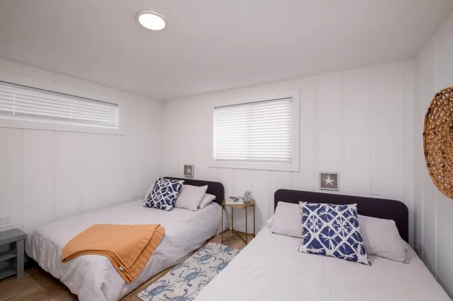 a bedroom with bed and a window