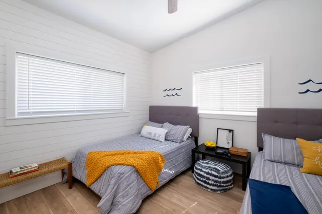 a bedroom with furniture and a window