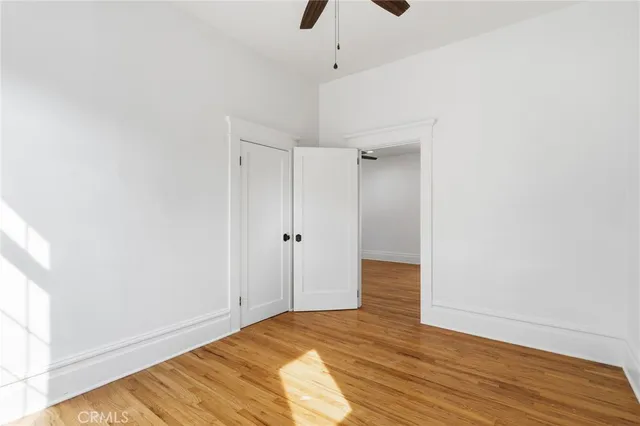 a view of a room with wooden floor