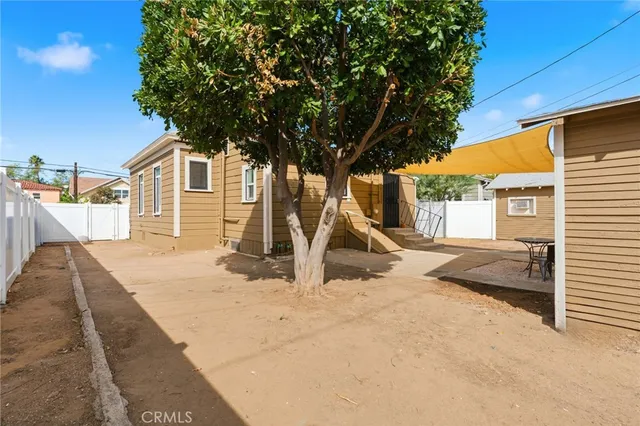 a house with trees in front of it