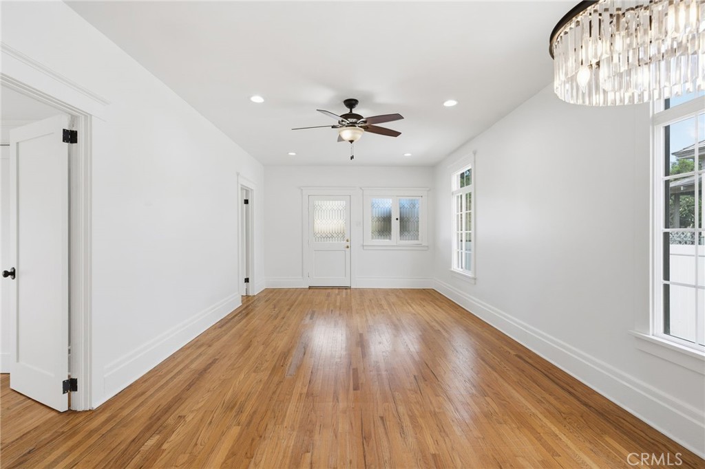 3756 Locust Street Riverside, CA 92501 - Photo 6 of 22 wooden floor in an empty room with a window