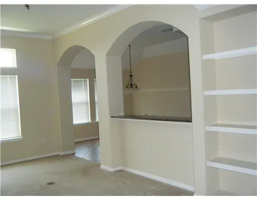 a view of empty room with windows