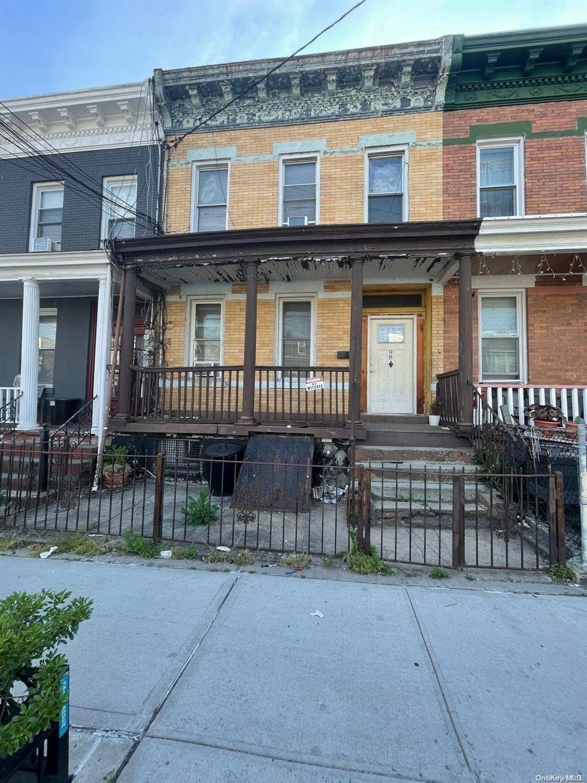 a front view of a house with a porch