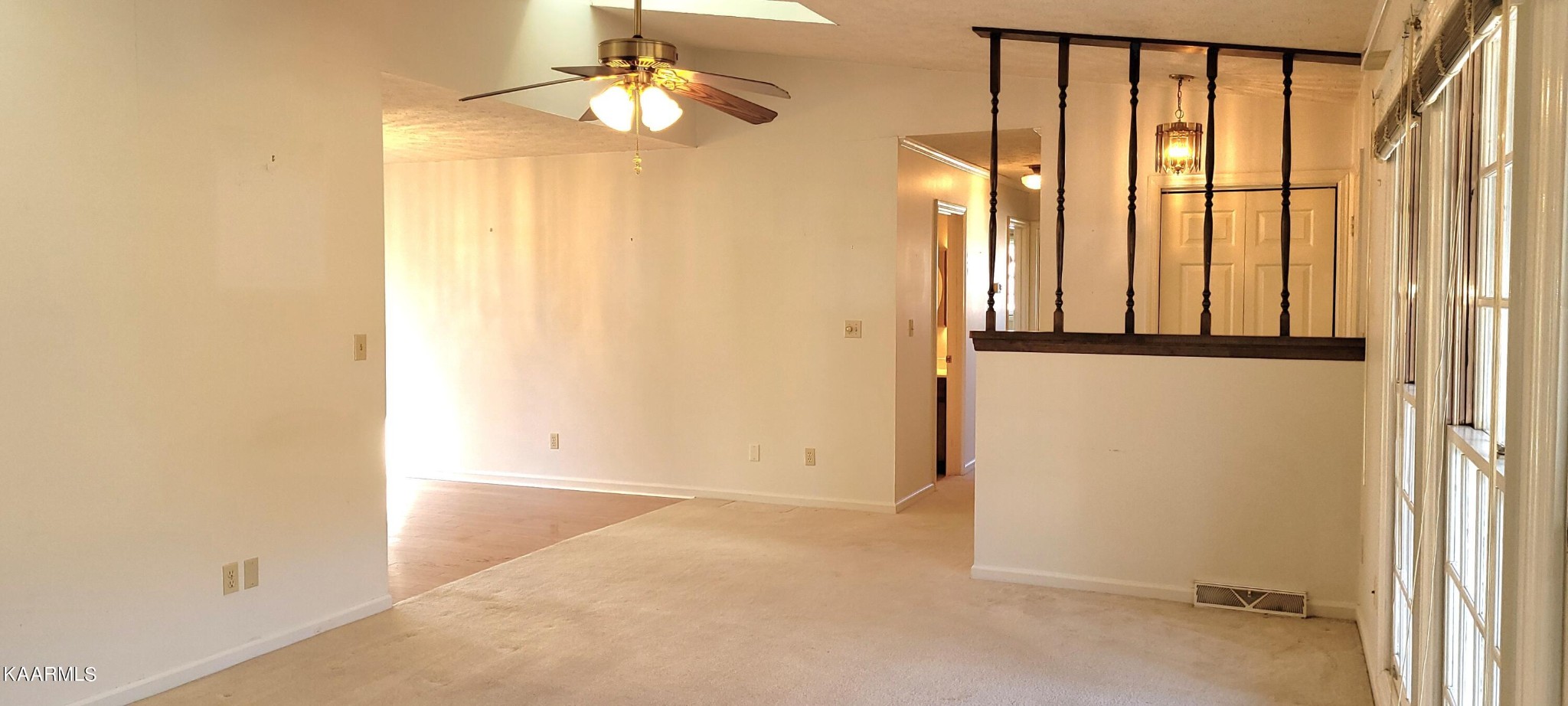 115 Claremont Road Oak Ridge, TN 37830 - Photo 4 of 39 an empty room with windows and entrance