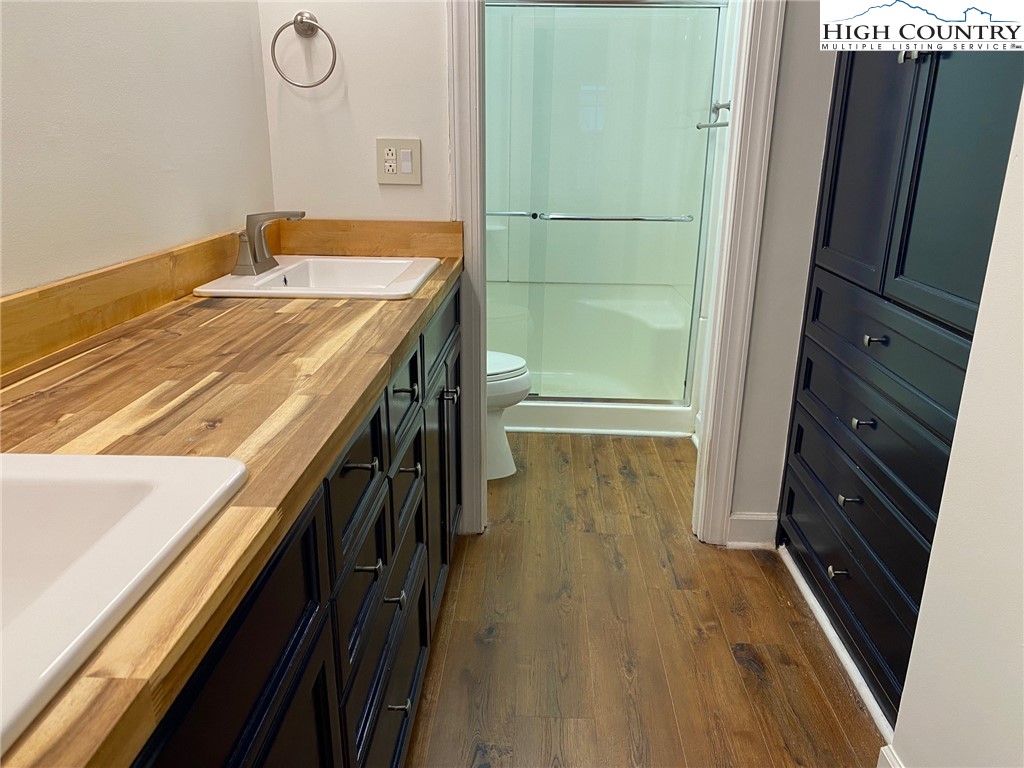 3520 Colony Road, Unit F Charlotte, NC 28211 - Photo 15 of 18 a bathroom with a sink a toilet a shower and a window