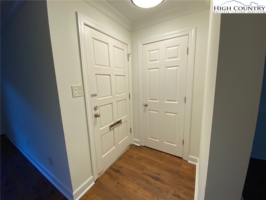 3520 Colony Road, Unit F Charlotte, NC 28211 - Photo 2 of 18 an empty room with wooden door