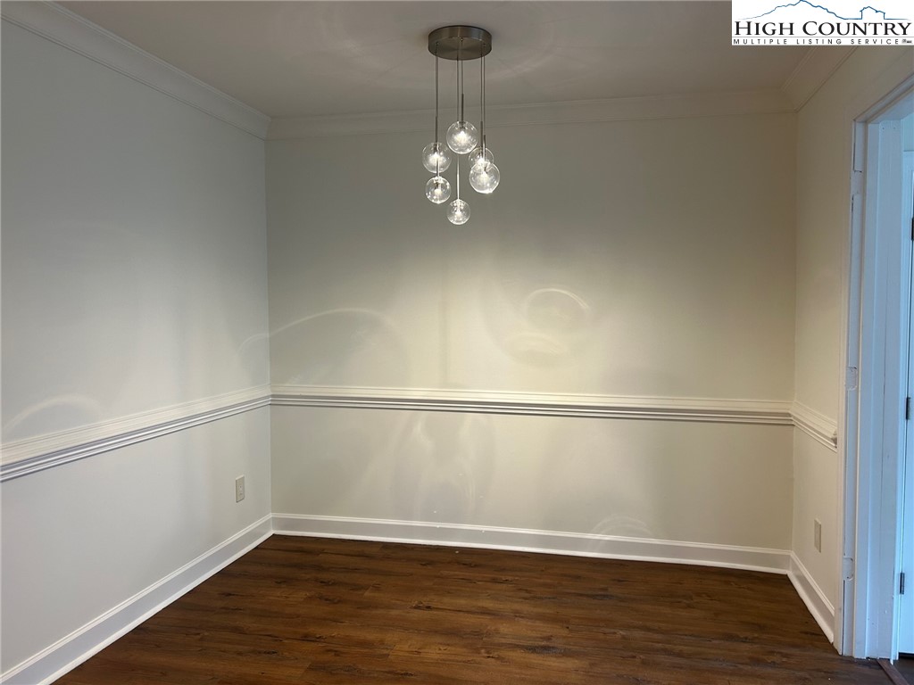 3520 Colony Road, Unit F Charlotte, NC 28211 - Photo 5 of 18 a view of an empty room with wooden floor and a window