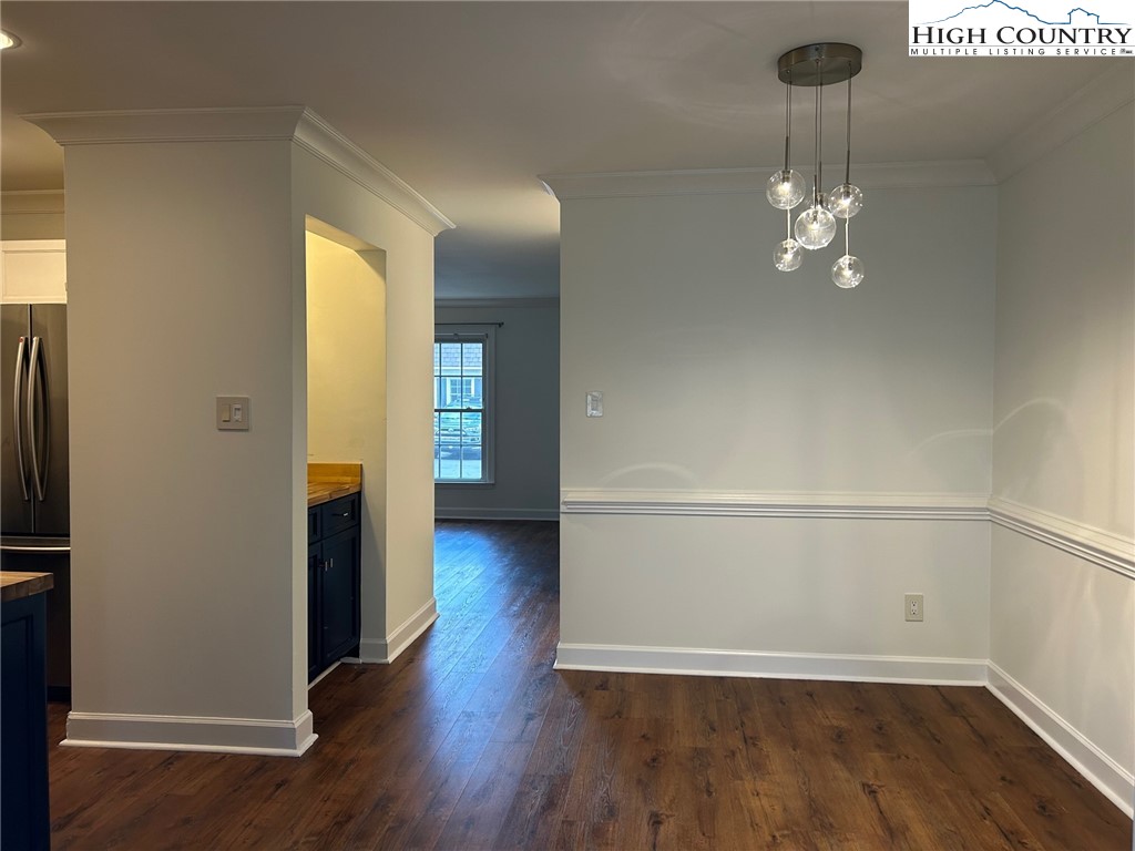 3520 Colony Road, Unit F Charlotte, NC 28211 - Photo 6 of 18 a view of an empty room with wooden floor and a window