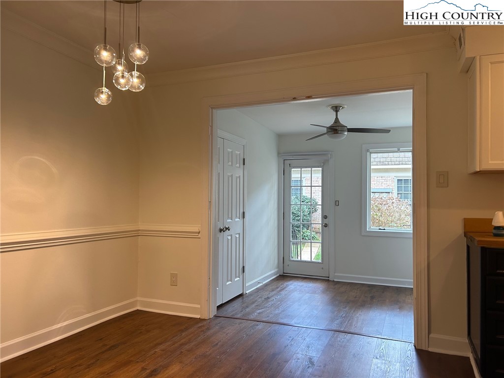3520 Colony Road, Unit F Charlotte, NC 28211 - Photo 8 of 18 a view of a room with wooden floor and chandelier