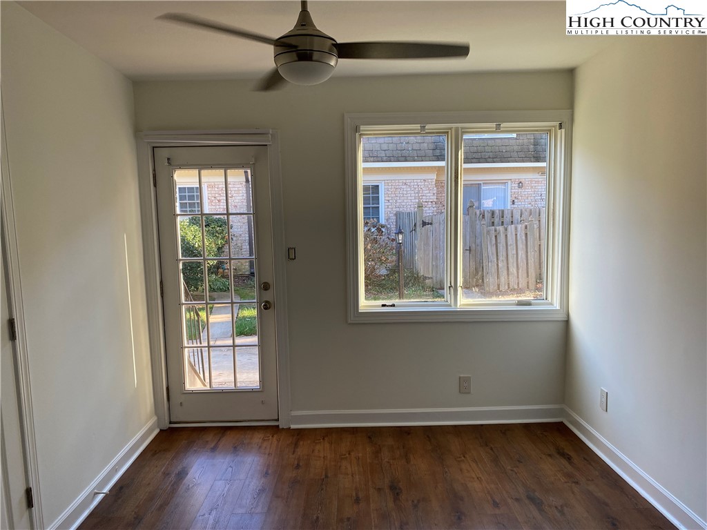 3520 Colony Road, Unit F Charlotte, NC 28211 - Photo 9 of 18 an empty room with wooden floor and windows