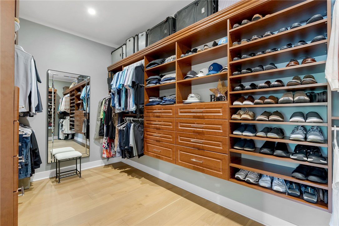119 Drewberry Lane Sunset, SC 29685 - Photo 17 of 42 This custom closet features extensive storage, showcasing meticulous organization and elegant wood finishes.
