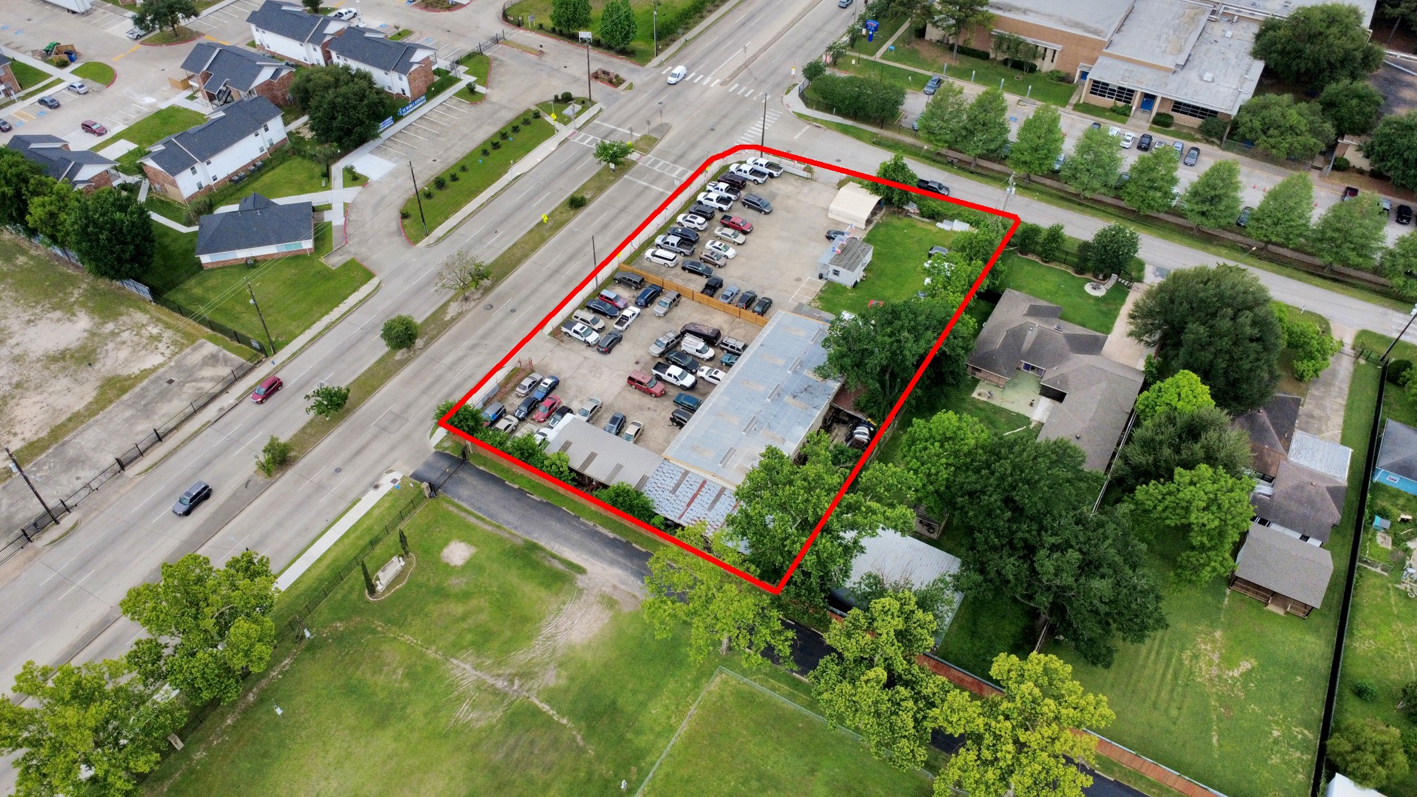 703 East Little York Road Houston, TX 77037 - Photo 10 of 14 an aerial view of a tennis ground with a large trees
