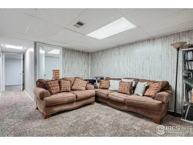 a bedroom with a bed and a night stand