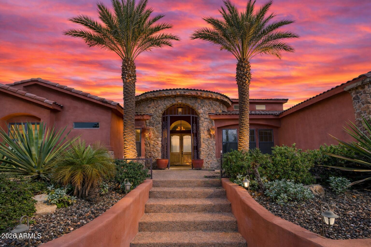 6646 East Lone Mountain Road Cave Creek, AZ 85331 - Photo 1 of 37 a front view of a house with plants