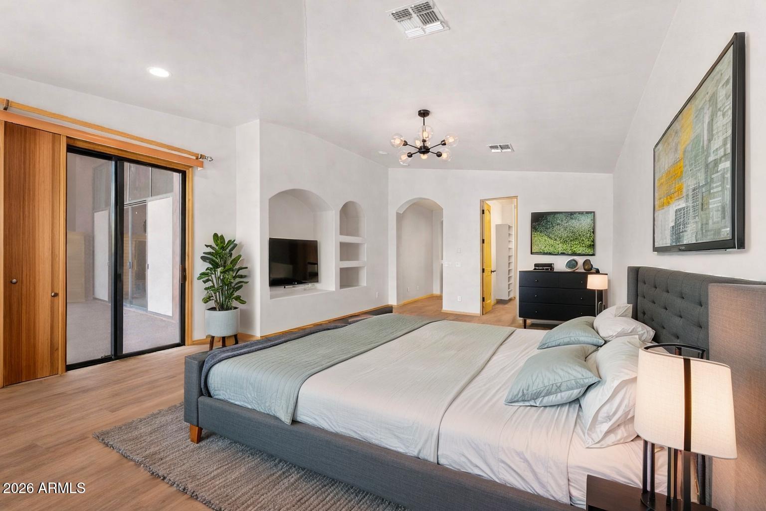 6646 East Lone Mountain Road Cave Creek, AZ 85331 - Photo 17 of 37 a bedroom with a large bed and flat screen tv