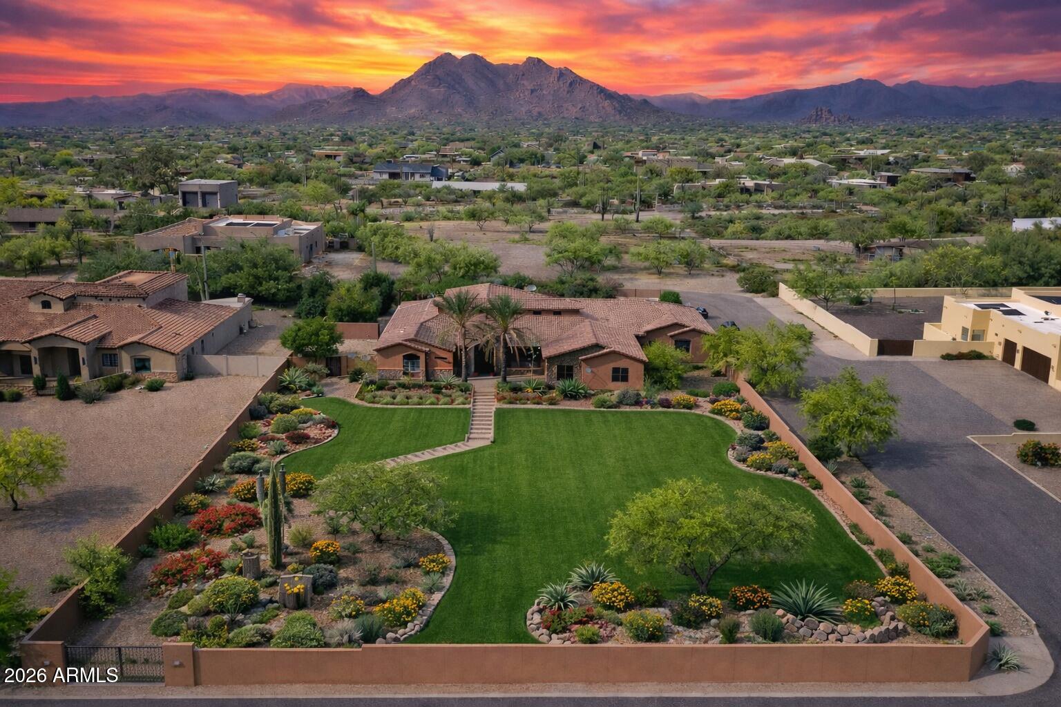 6646 East Lone Mountain Road Cave Creek, AZ 85331 - Photo 2 of 37 an aerial view of a house with a garden